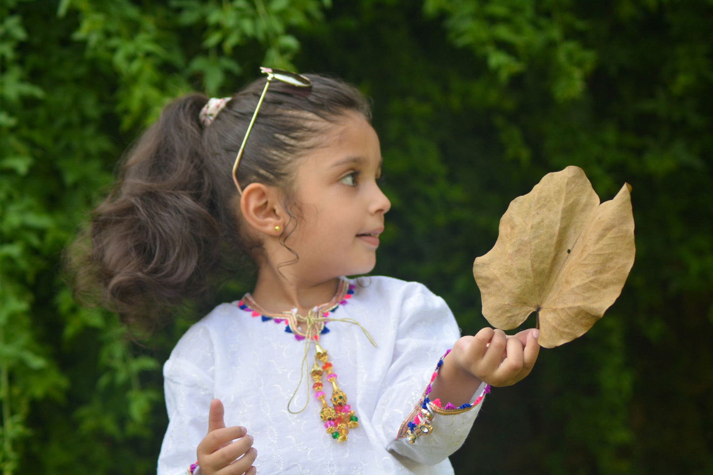 White Chikan-Kari Shirt with colorful tassel and green printed Skirt