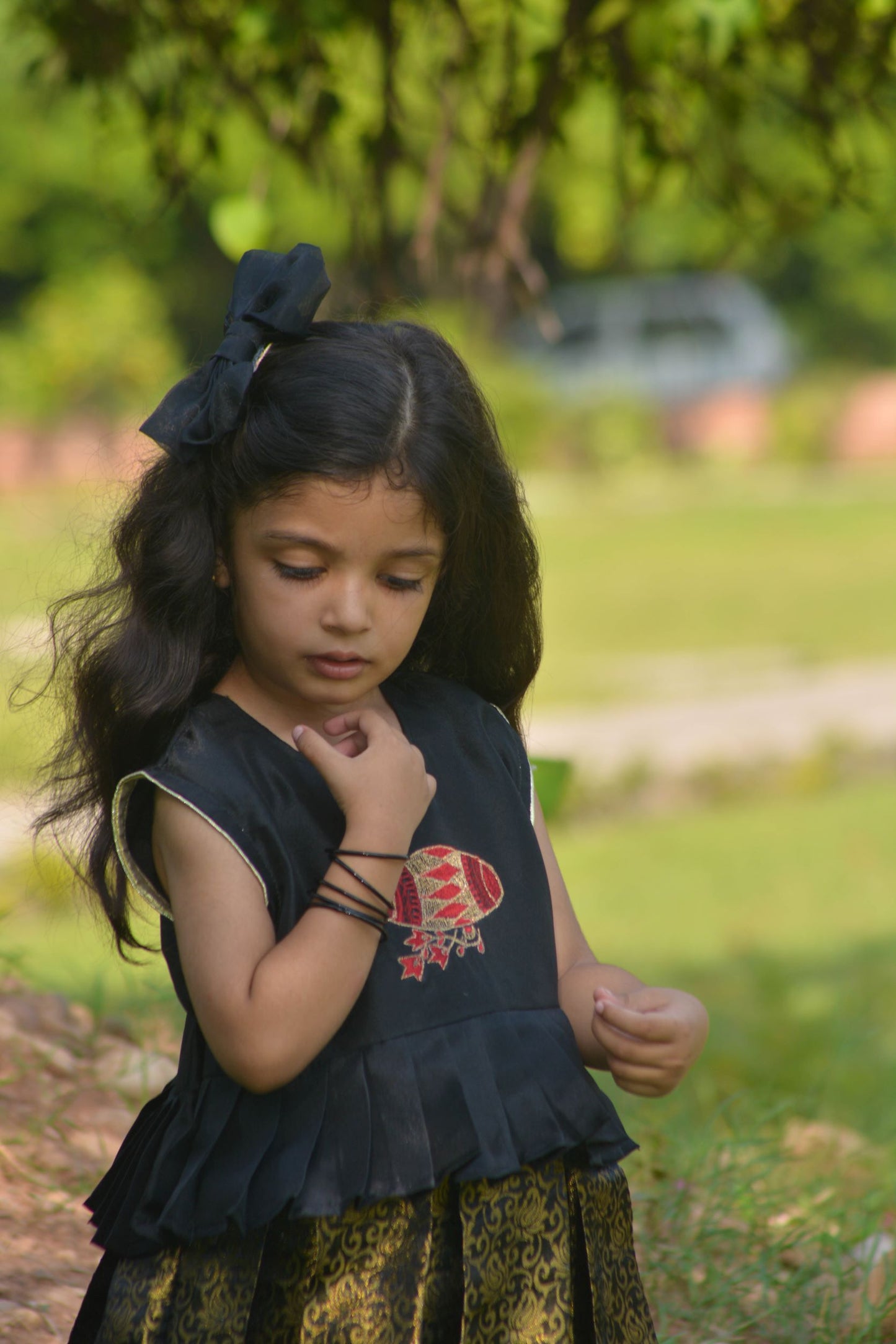 Sleeveless Frock with embroidered motif and golden printed Skirt