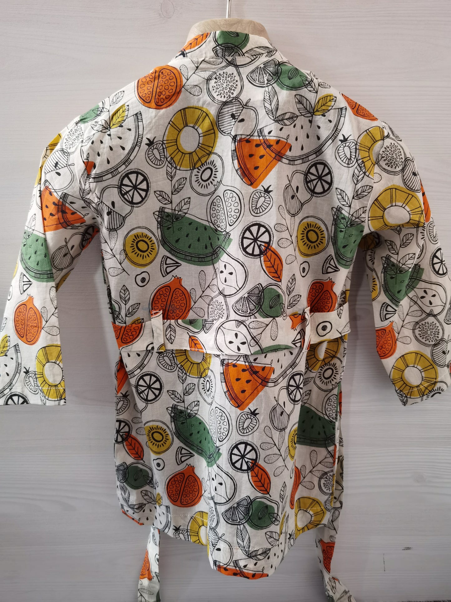 White fruit printed coat with belt and black sleeveless Shirt